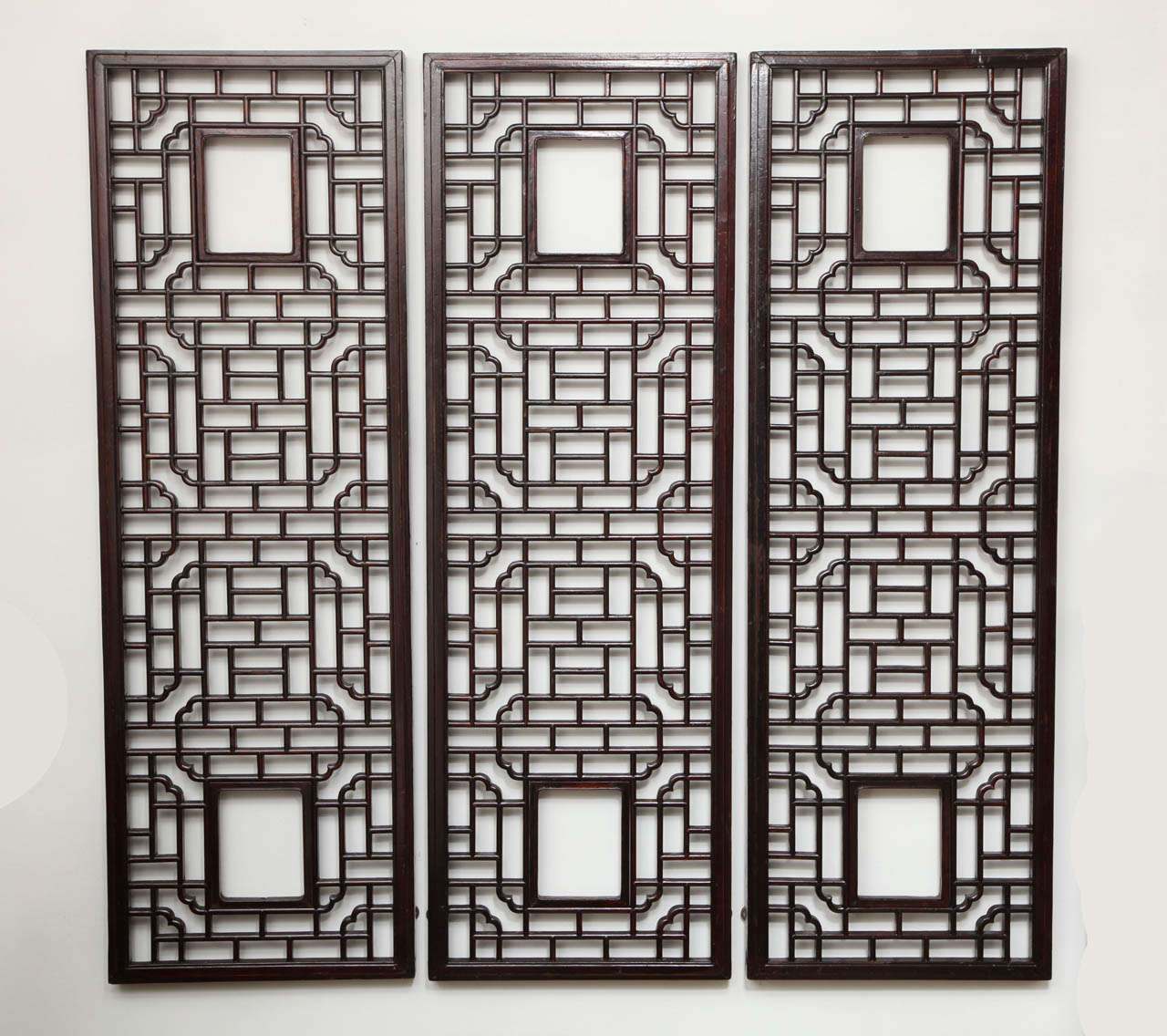 Three long Chinese lattice screen panels.  Classic wall decor or divider.  Can be backed with a mirror.  Only one still available.