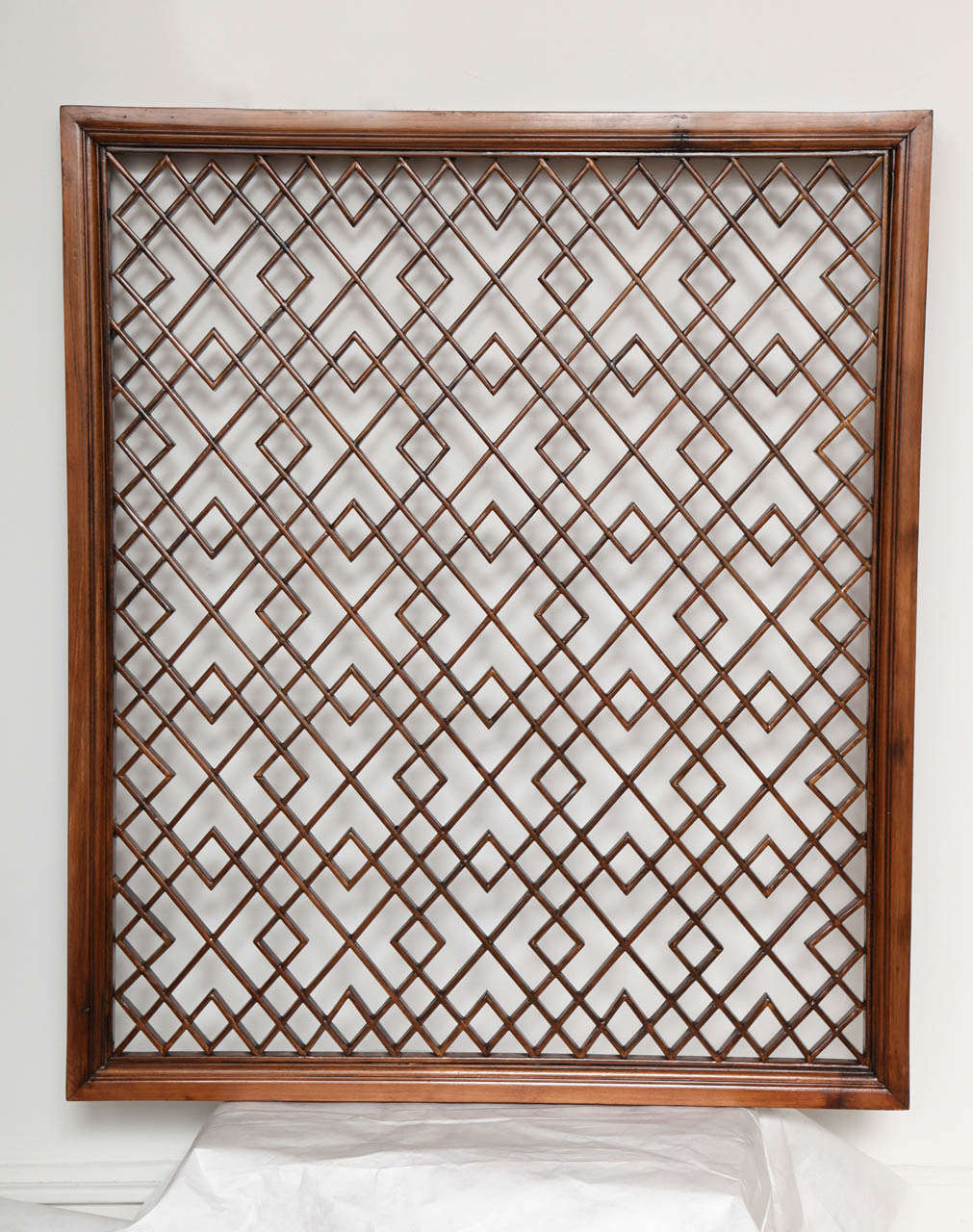 A wood lattice screen or panel in a traditional Chinese pattern. Can be mirrored. Two available, sizes differ slightly.