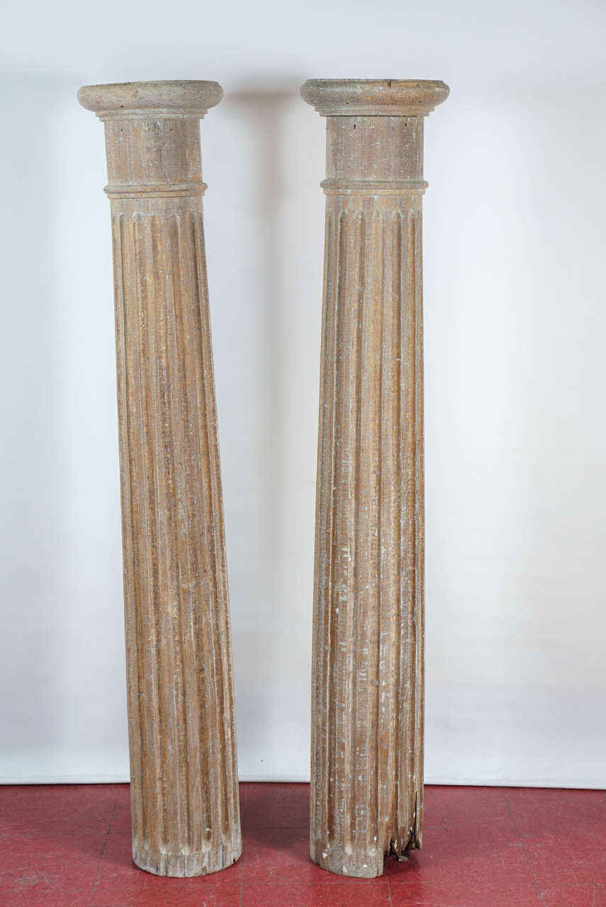 In the Tuscan style, these fluted and tapered hard wood columns could be attached to circular bases or taller square plinth-like bases or left as is. If secured to the floor or in another fashion, the columns are perfect to top with urns or vases.