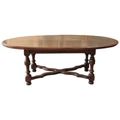 A Large Oval Walnut Italian Table, early 19th c.