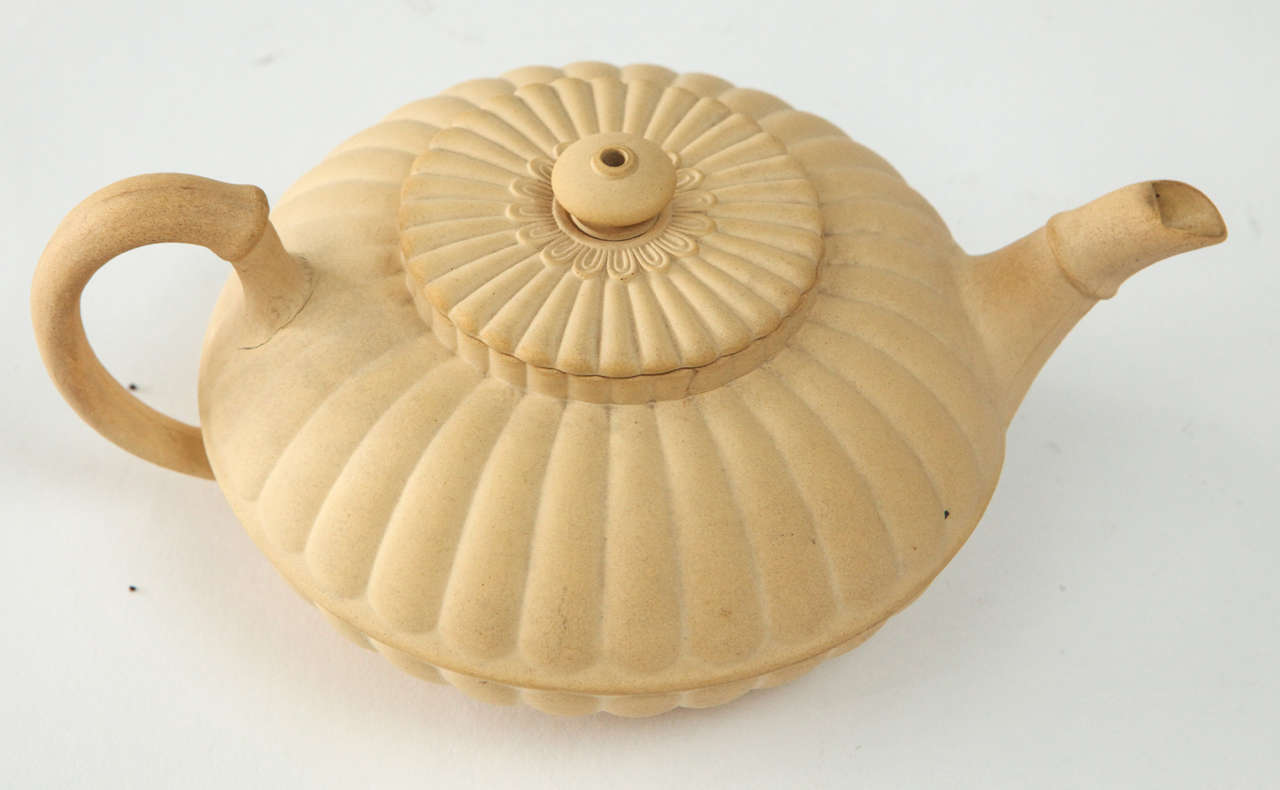 A Wedgwood caneware small teapot, lotus pod form, circa 1810.