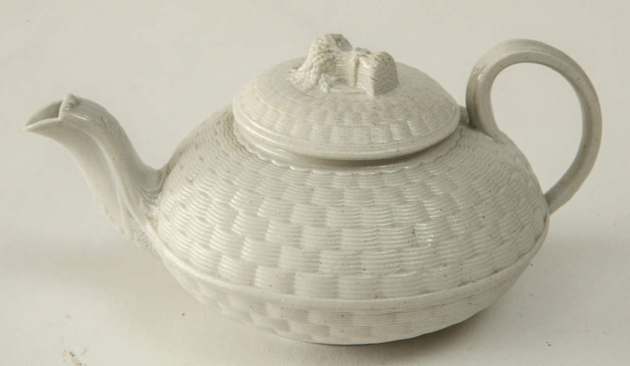 A Wedgwood (unmarked) Saltglaze White Stoneware Teapot with Basket Weave
Body and Wheat Sheaf Finial, c. 1820