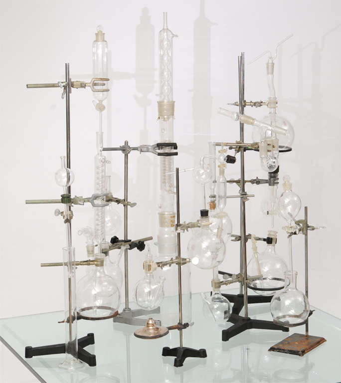 6 free standing groupings of vintage American laboratory bottles and beakers.  The amazing glass work detail and pristine condition make this set truly collectible.   Priced as a group.


Dimensions
Tallest: 43.5