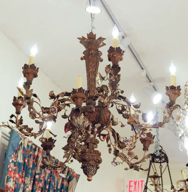 Italian Chandelier with giltwood stem iron arms with tole leaves and porcelain flowers