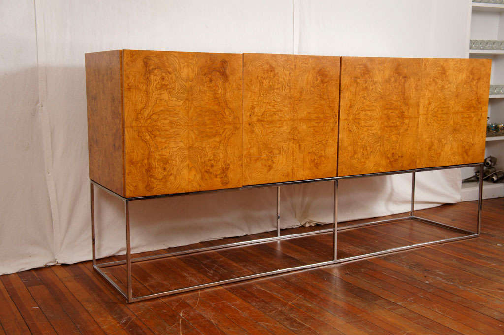 A favorite of the modern decorator, the Baughman thin frame floating sideboard. Chrome shines and is in great condition, Burl looks great as well.
Inside has shelves and drawers for silverware.
Grab it!