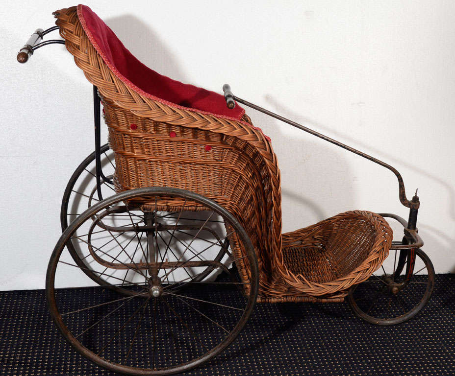 Polychromed Iron, Wicker and Fabric Pram with Wooden Push And Steering Handles.  Possibly From Brighton, England