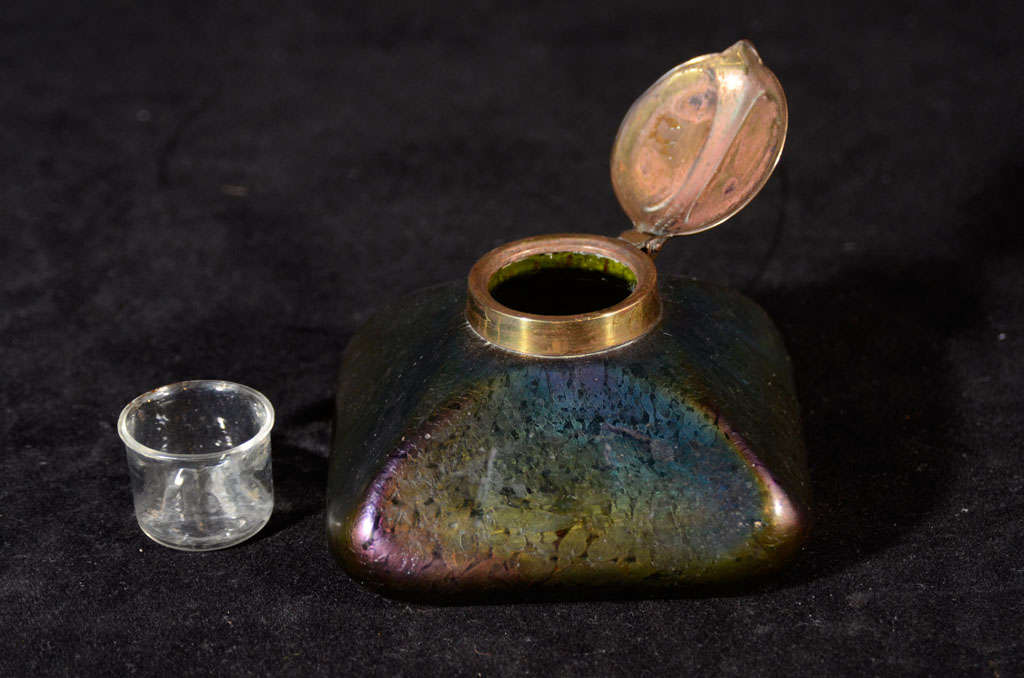 Tiffany style iridescent colored glass ink well with brass cap.