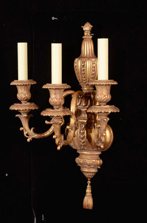 Pair of Adam Style three light gilt bronze sconces with foliate and pearl design ending in a cast tassel.