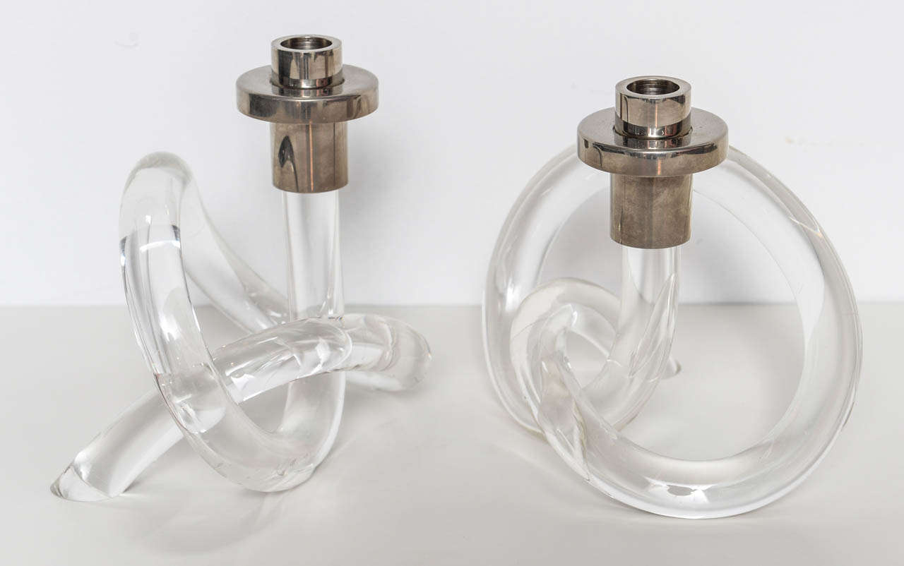 Iconic Hollywood Regency chrome and Lucite twisted candle holders designed by Dorothy Thorpe. An exquisite pair of 1960's candle holders. The lucite is nice and clear with no crazing. The silver plated has been chromed. A perfect addition to any