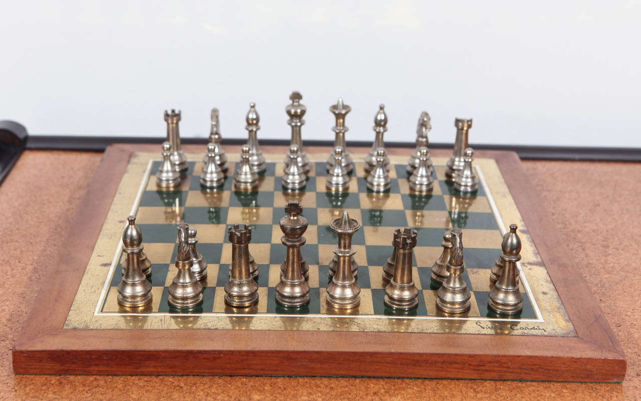 Rare Pierre Cardin chess set. Wooden board with brass inlay and metal cast game pieces.