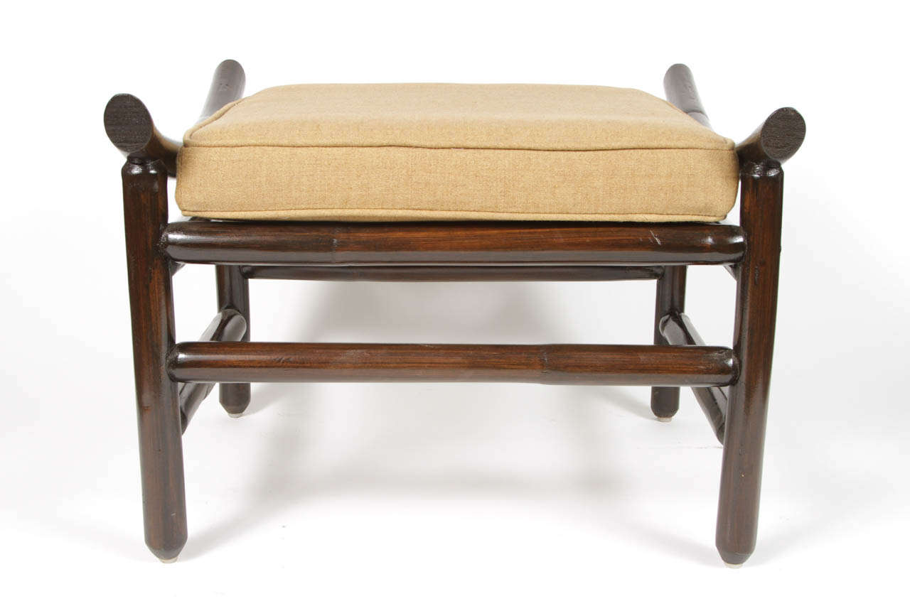 Vintage rattan foot stool with new dark espresso finish and caramel linen cushion.