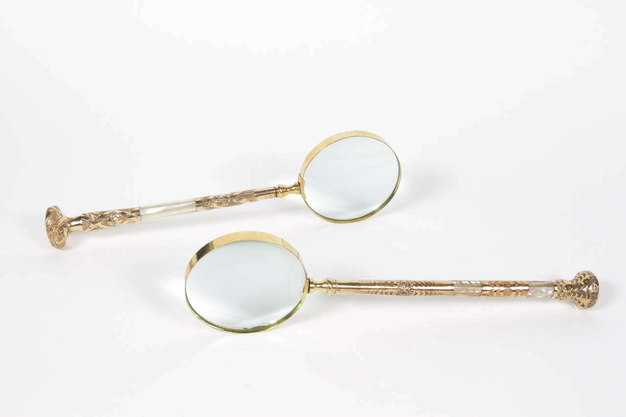 Large magnifying glass made with antique parasol handle c.1850-1900. Gold plate and mother of pearl. 

One with initials GER 14.25