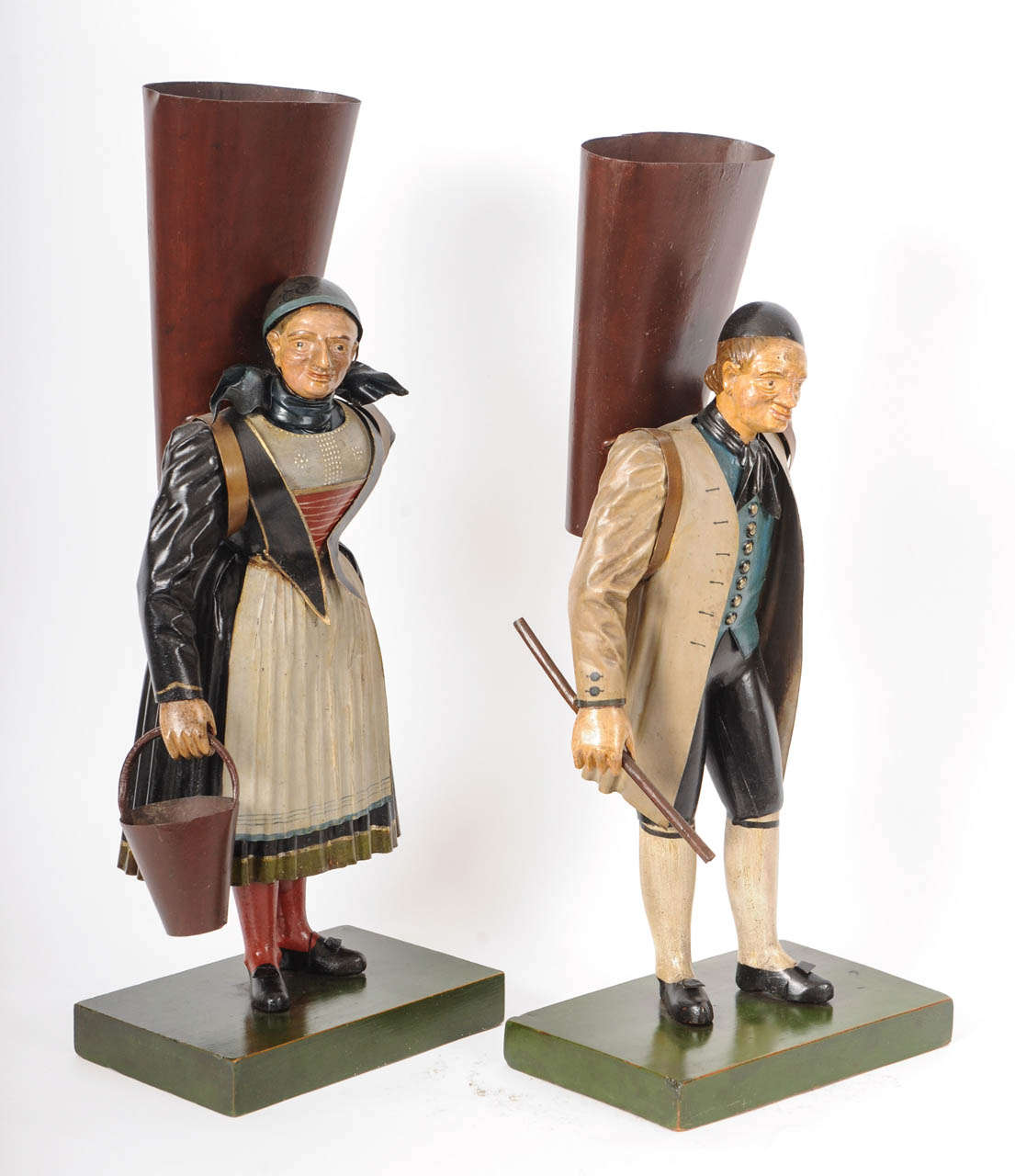 A pendant pair of German Black Forest polychrome metal figures, circa 1840