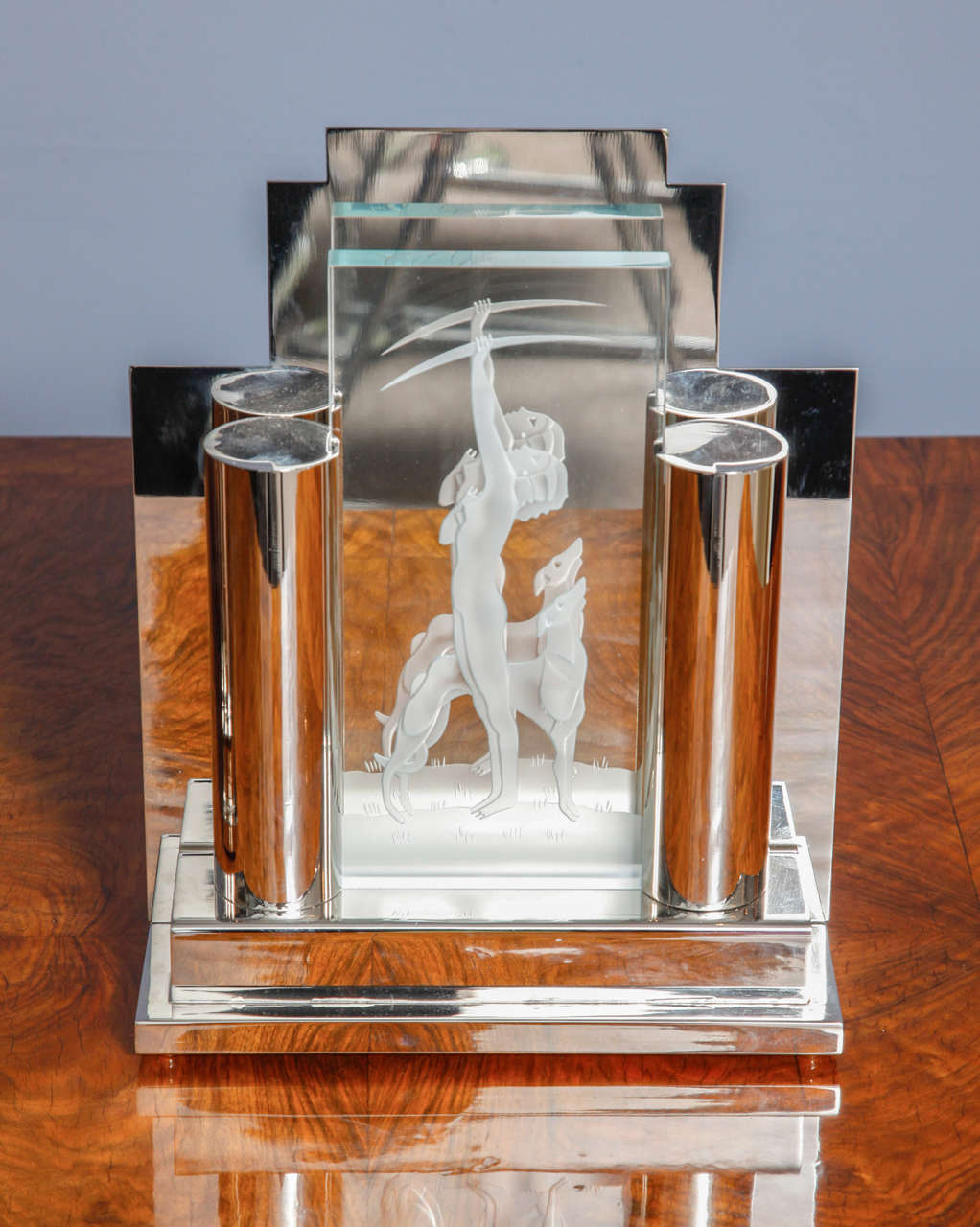 Exceptional pair of Art Deco table lamps, nickel-plated metal frame and etched glass in which as a motive you can recognize the figurine of a hunting lady and her dog. Simply beautiful, easy to place in a bed room or even in the living room.