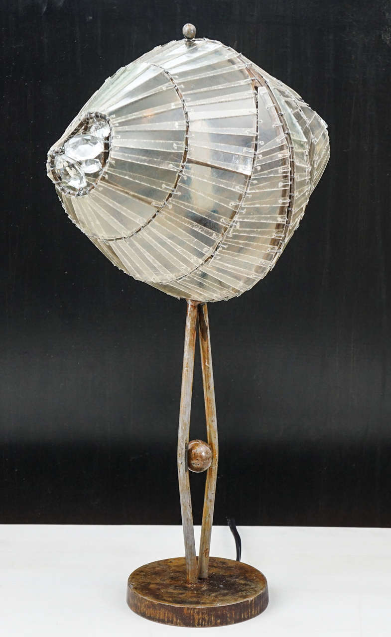 Unusual table lamp by Italian designer, Valentina Giovando.
Torpedo shaped, slivered fiberglass globe, with crystals attached at either end.
Stands on a 5