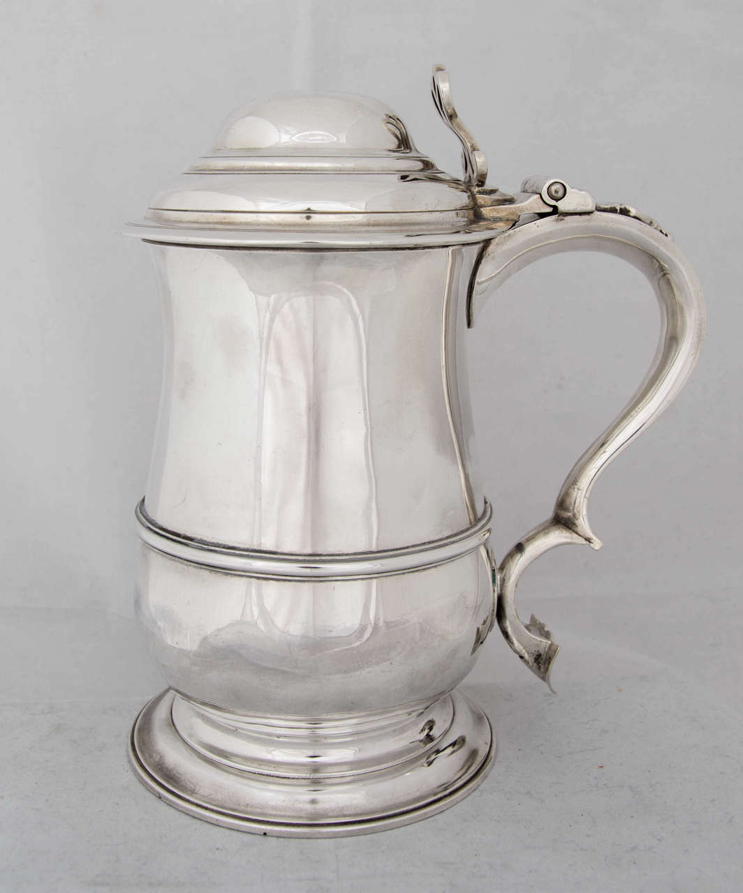 A George III sterling silver Tankard made in London, 1765 by Francis Crump.
The handle is engraved with the initials of the original owner, "IH".
Height is 8".
