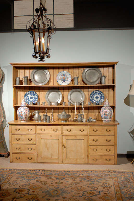 This wonderful all original pine dresser from Sussex, England is an outstanding piece.  It offers storage and display without much depth.  It has that gorgeous patina that only old pine can offer.  A proud English piece that is versatile as well