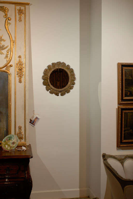 18th Century Carved Italian Round Mirror<br />
One of a kind item.  Please see our website for additional items www.jadamsantiques.com