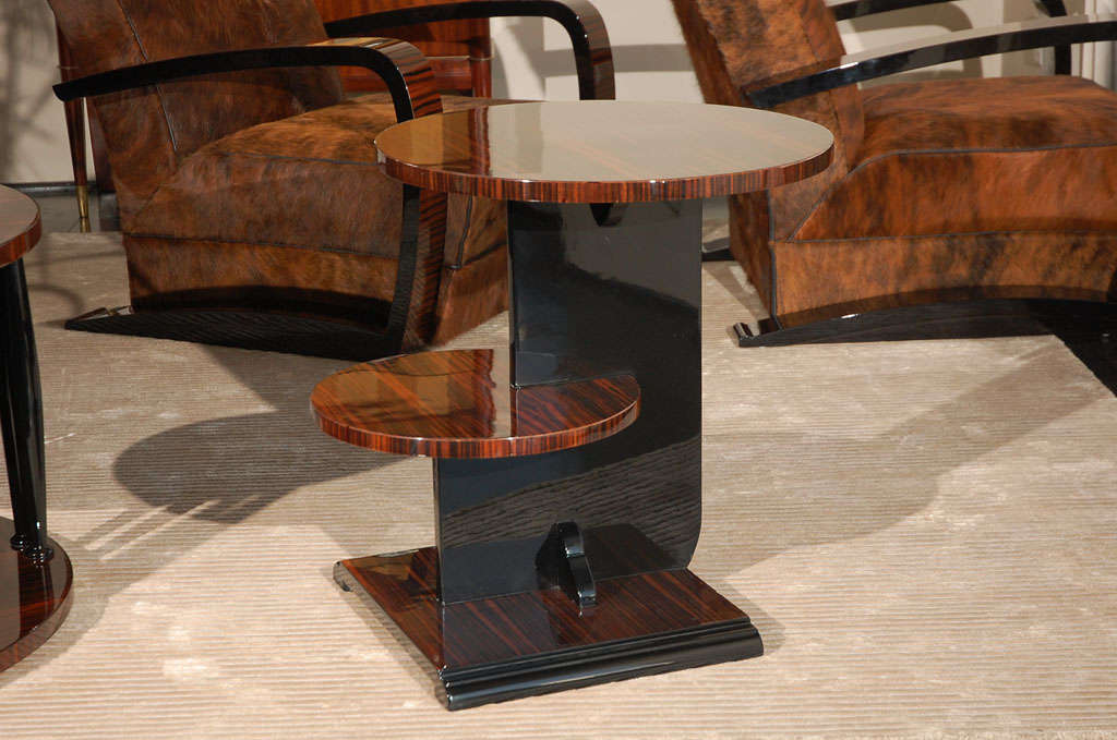 Modernist design side table. Beautiful Macassar table top with black lacquer center body. Stepped, 2-tiered tops for additional space.