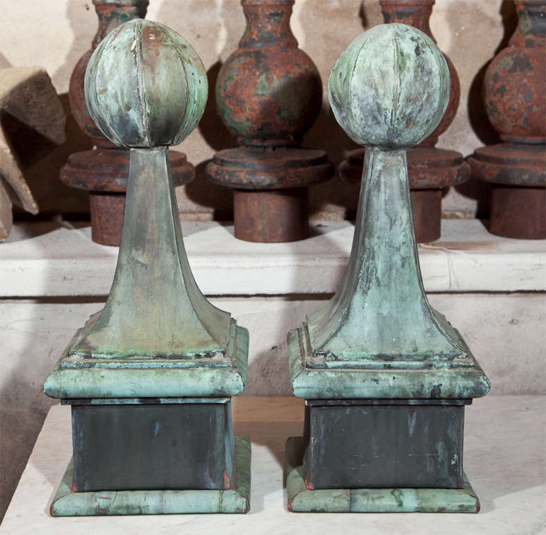 With their natural verdigris patina that can only be achieved over time, these classic and elegant ball-topped finials have more than the usual punch to them.  Looking closely, you will see that these ball tops are sectioned in 8 parts, much like a