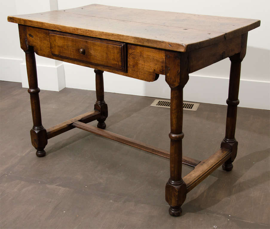 Antique wood table, France, c. 19th century

Sturdy wood construction, rustic top, charming turned legs on peg feet, and single drawer with handsome knob.
  