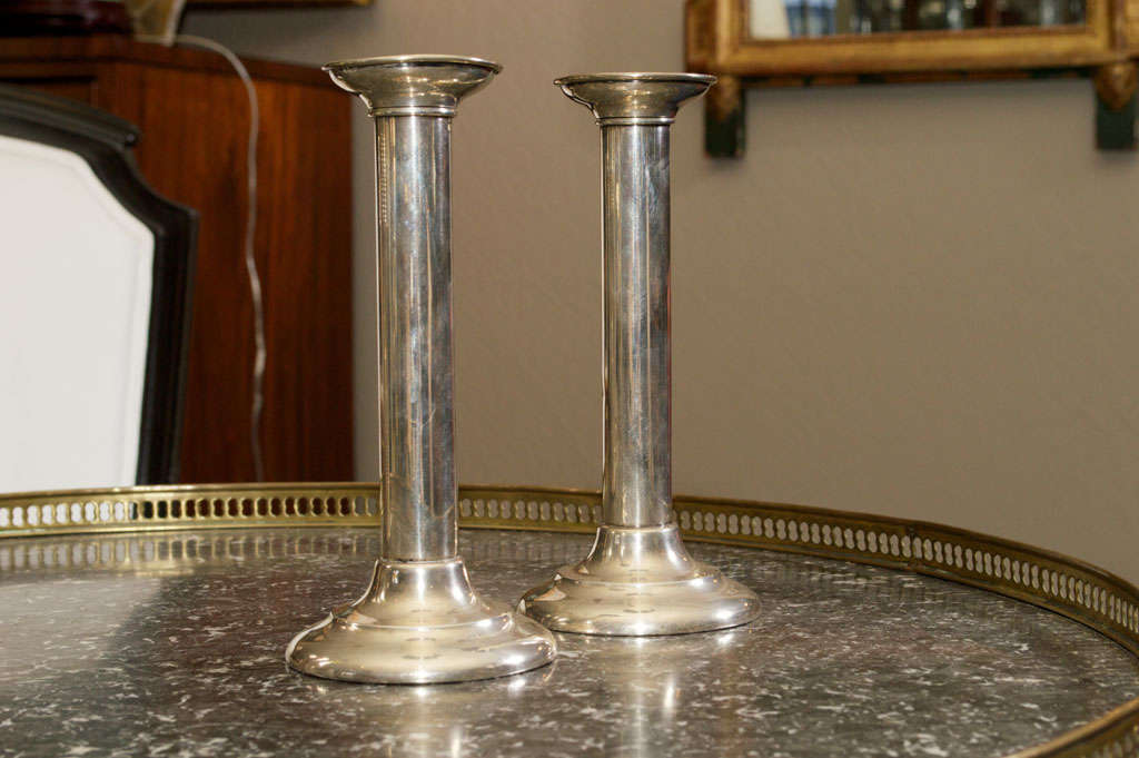 Each removable candlecup raised on columnar standards inscribed with an 'S' ending on a domed circular base, each with Reed & Barton, Massachusetts, marks on underside.