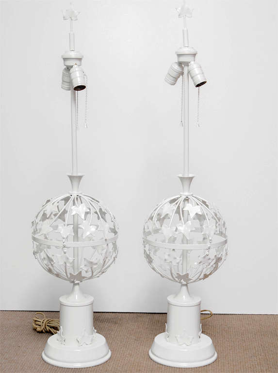 Light and airy, these table lamps could round out a beach house or outdoor living space. Ivy-like metal leaves wrap around the metal frame of the lamps.  Shades are not included.  2 bulbs per lamp are switched on with pull chains.