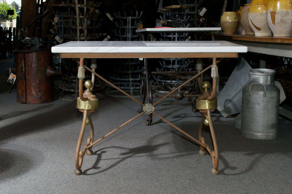 Very nice French butcher/pastry table with white marble top and a cast iron base with brass and zinc decoration