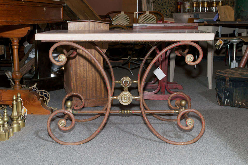 Classic French butcher/pastry table with original fossilized marble top, on an elegant cast iron & brass base