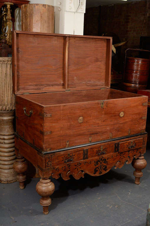 Mahogany trunk with brass finishing and ebony piping. Bottom platform also has 3 drawers.
