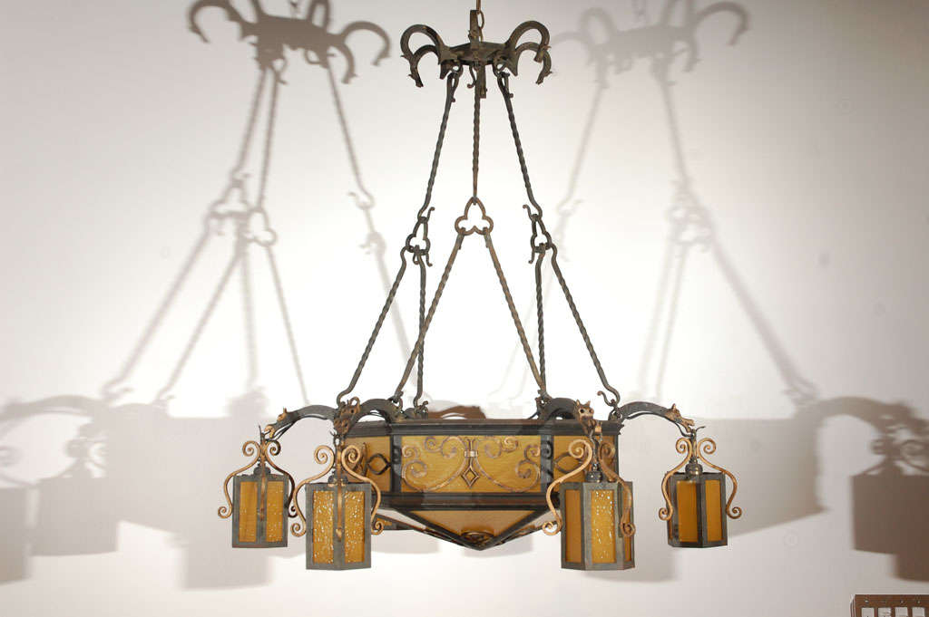 Brass and iron 1940s French chandelier with fleur de lis and dragon details. Gold glass is new.