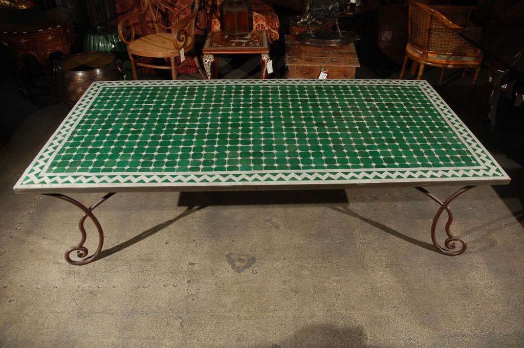 Handcrafted vintage mosaic tile table top, hand-made using reclaimed green and white Moroccan glazed tiles.Amazing Moroccan coffee table on a heavy French style wrought iron base could be used indoor or outdoor.


We specialise in rare 18th and