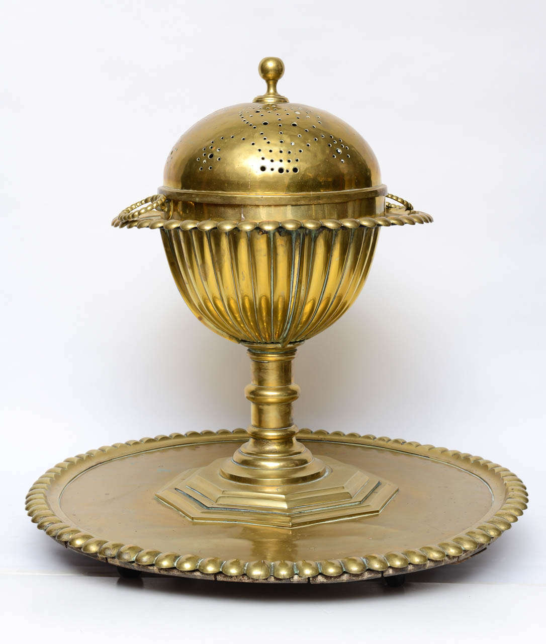 Originally $ 7,500.00

Turkish/ Arab Brass Brazier/ Mangal, comprised of 4 pieces

The body is divided into two parts. The upper part a deep conical shape, designed to hold the ash-bowl, which is surrounded by a rim 15cm. 16cm. wide. This was