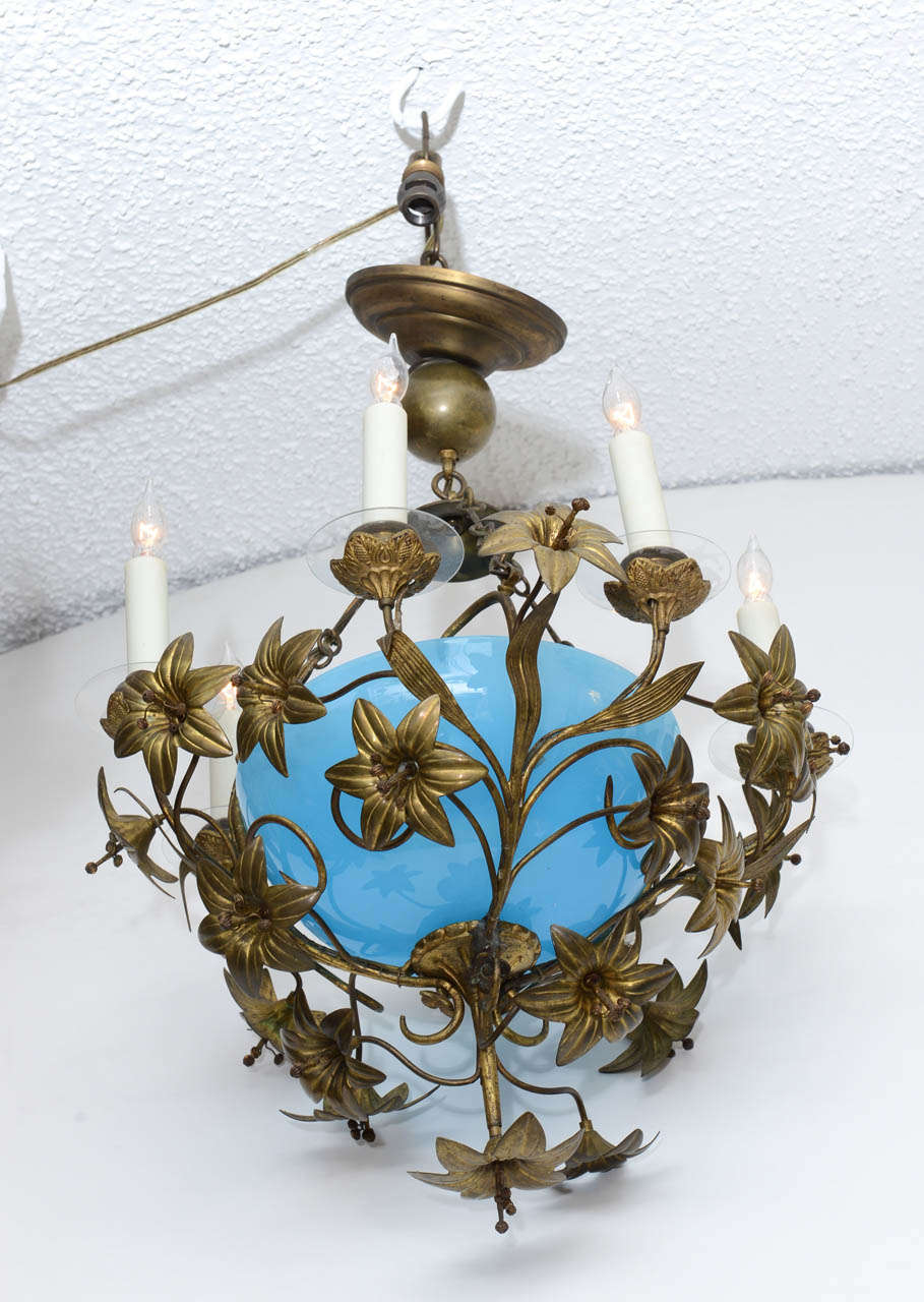 French Blue Opaline & Ormolu Chandelier: most sort after fixture, opaline & ormolu,  radiating candle arms surrounded with lily type ormolu flowers, newly wired with custom wax drip candle sleeves, original restored finish

The term 