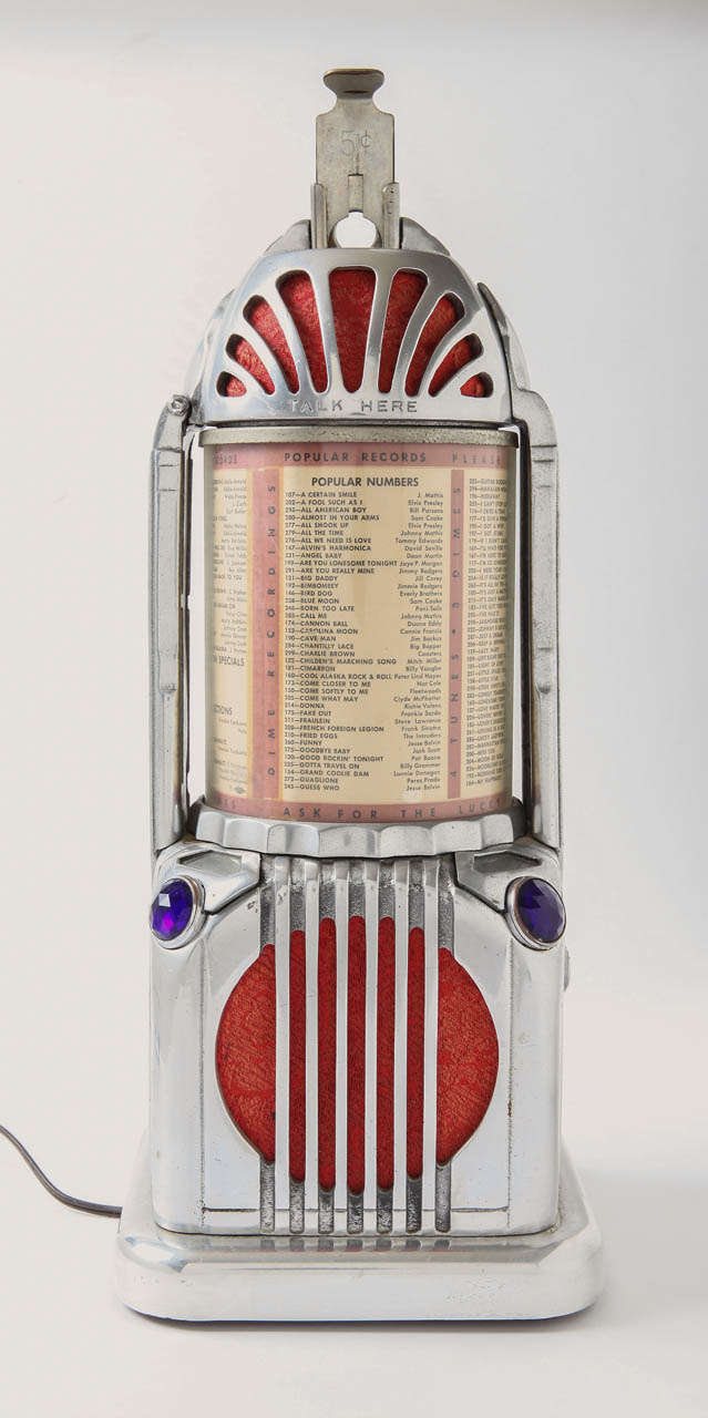 Polished aluminum and original red cloth, with glass jewel light-covers and lucite menu cover.

These were used in NW US ca 1940, as the first telephonic juke box call boxes.  Amazing history.

Original 5-cent version.

Very good condition,