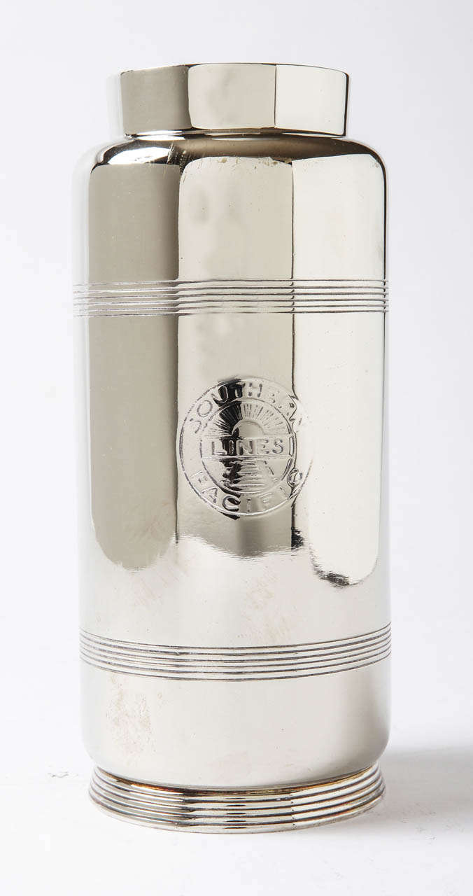 Silver plate vase / pitcher, with incised lines and Southern Pacific Lines logo.

Form is likely a Guild design, Model # 05049A.

8.5