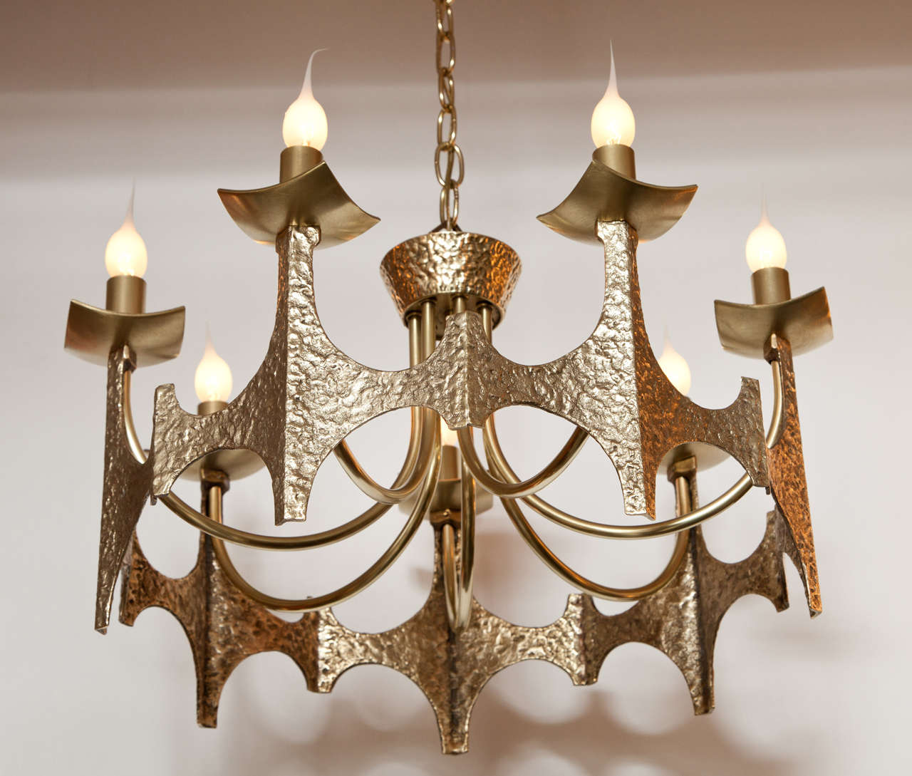 Decorative Brutalist brass chandelier, circa 1950.