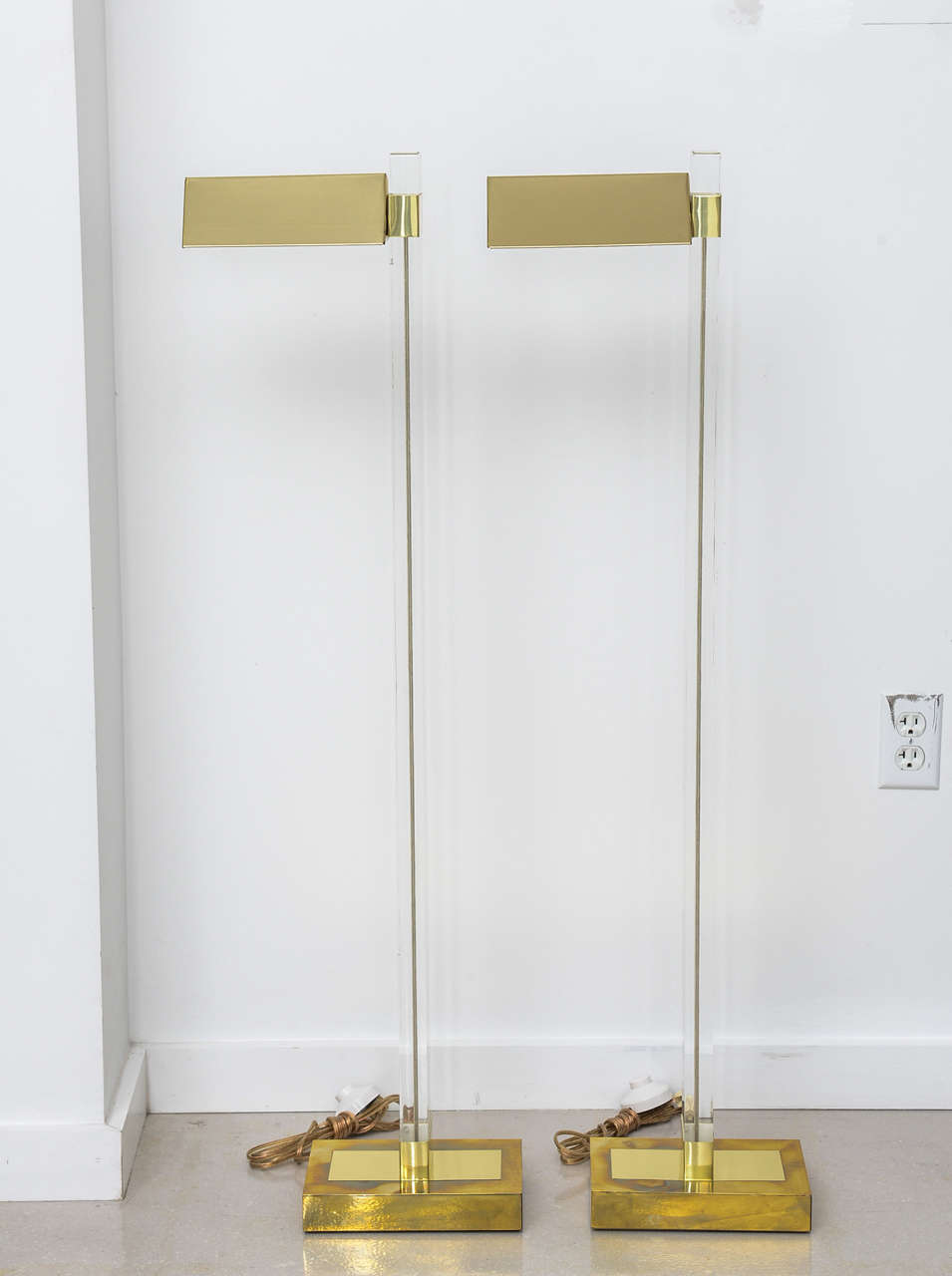 Pair of Lucite and brass floor reading lamps.