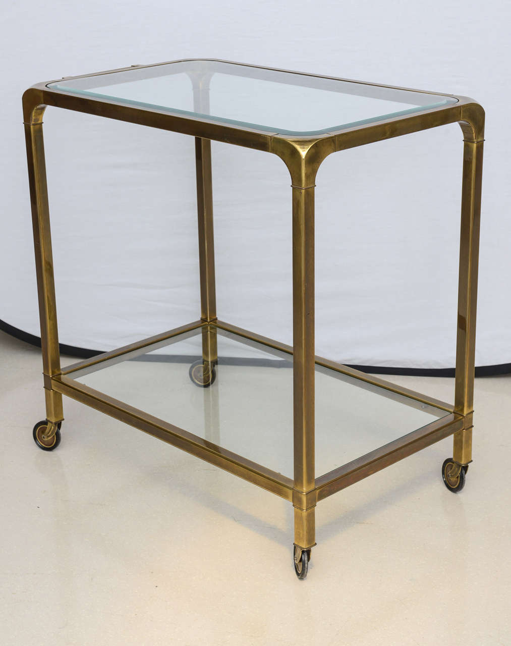 Brass Mastercraft trolley with two glass shelves.