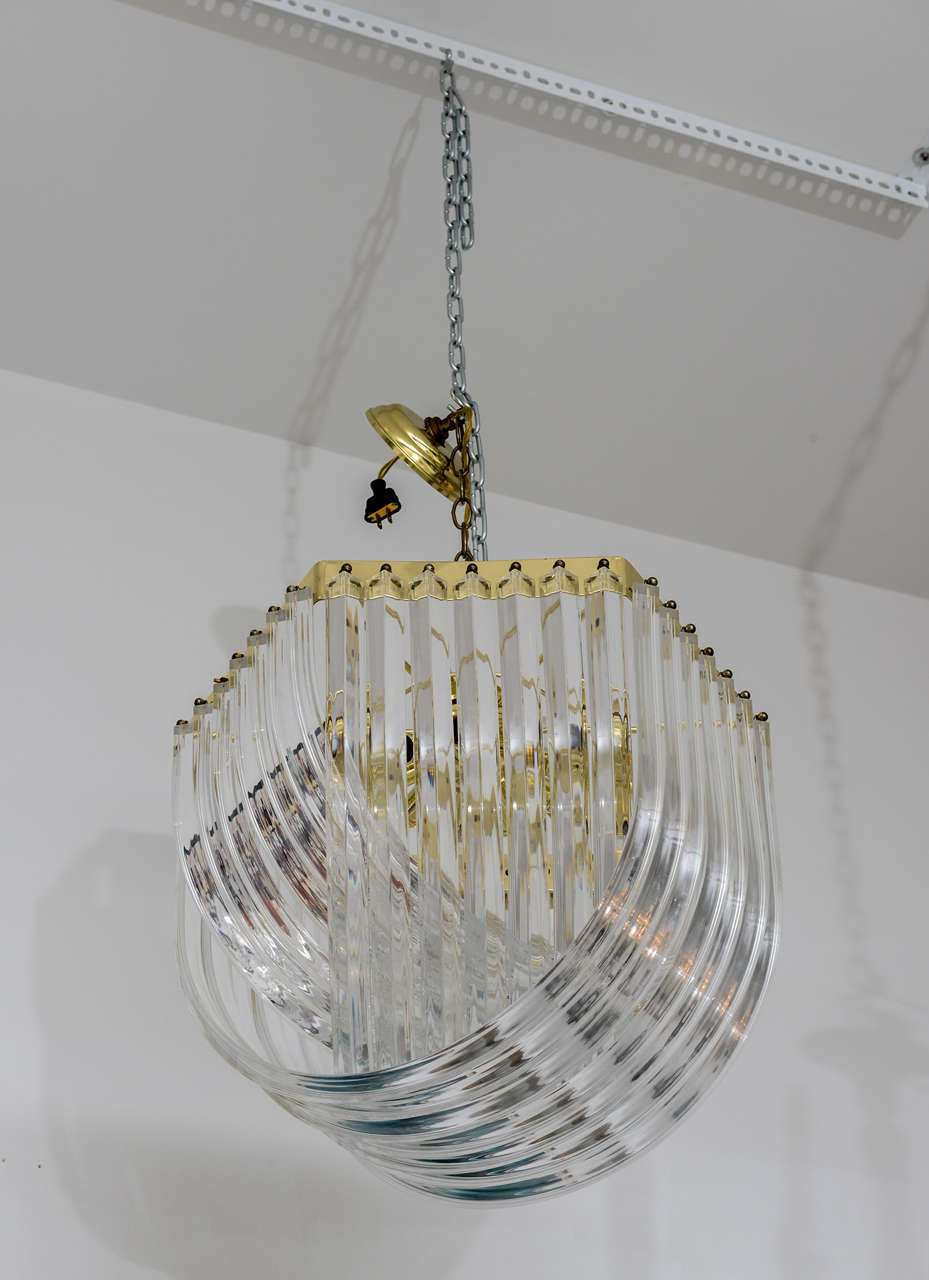 Large Lucite scoop light fixture with brass armature and canopy.