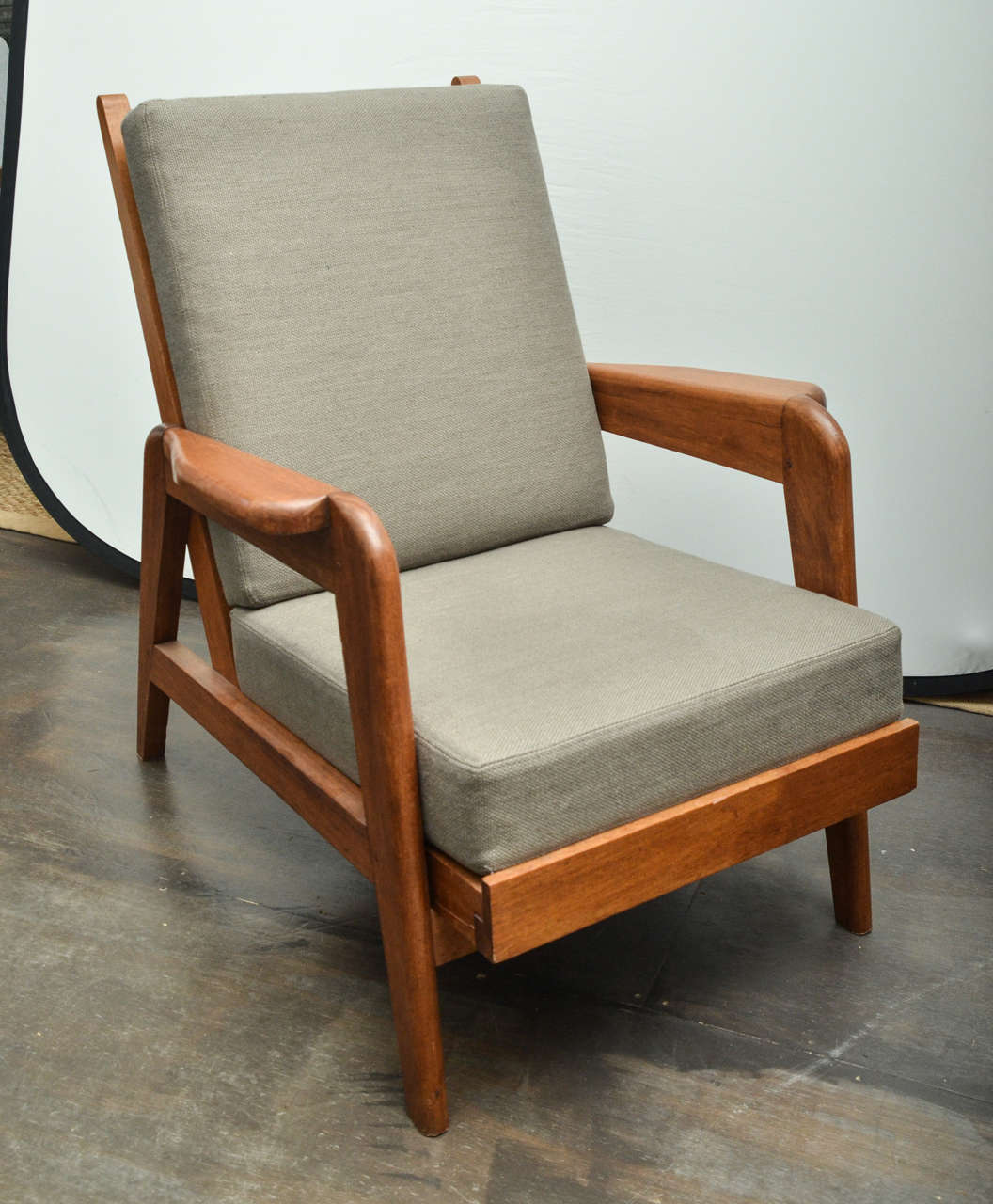 Pair of wooden framed armchairs attributed to Pierre Guariche. Newly upholstered in a taupe linen. Excellent condition.