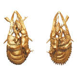 Antique Pair of Black Forest carved trompe l'oeil gilded trophees.