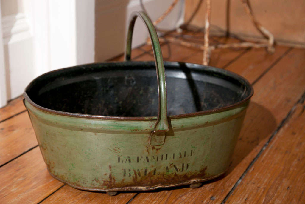 This charming toleware grape pickers' trug from France sports its original sage-green paint with 