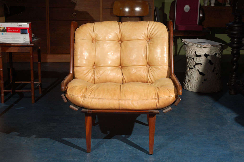 Brazilian low leather and rosewood armchair.