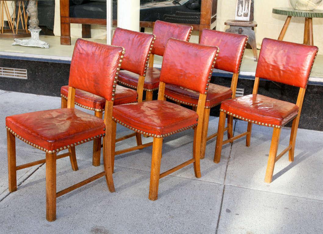 Set 6 red leather dining chairs, with large brass studs, in the manner of Kaare Klint, Danish mid-century modern