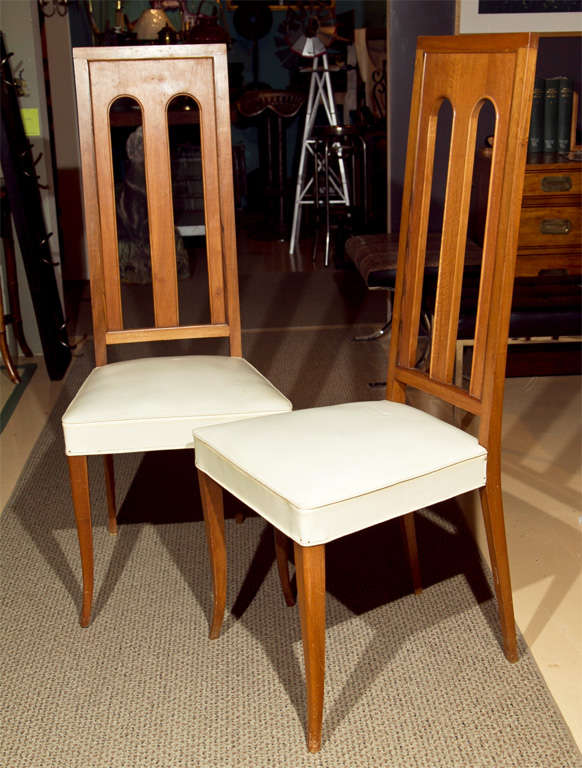 Set of 8 Italian-style Post-Modern chairs. White leather seats, faded walnut finish, which is aged.