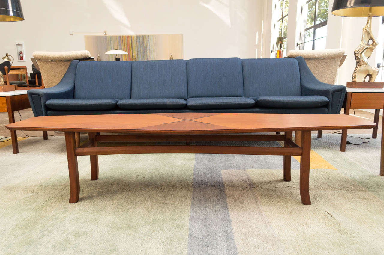 A unique coffee table of teak by Kipp Stewart for Drexel Furniture company with a hard wood 