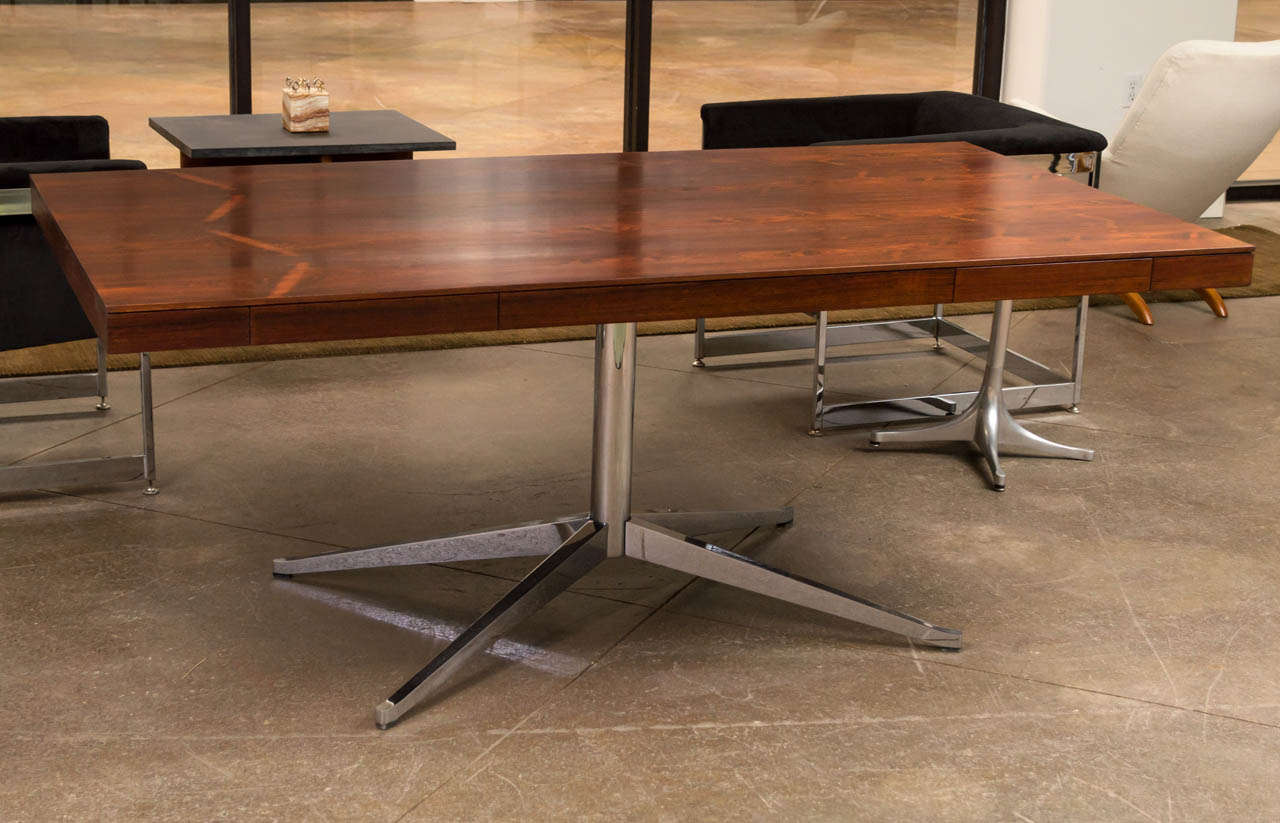 A partners desk in Brazilian Rosewood. Two drawers on either side of
the desk surface and a broad workspace for collaboration. Designed in 1961, it was a part of the Knoll line for almost 2 decades.