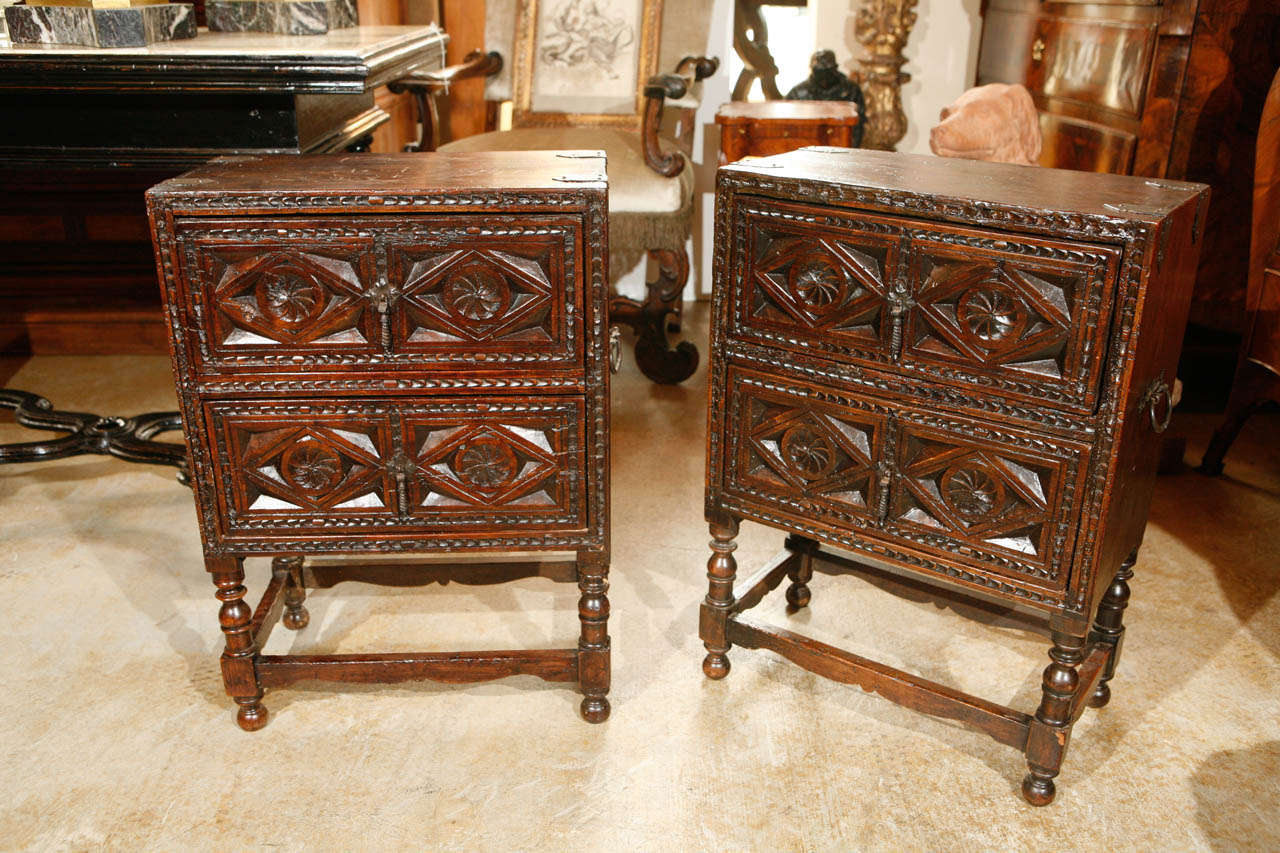 Two, mid-19th c,. Brittany chests with hand-carved panels, turned legs, scrolling stretchers and iron clasps and handles.