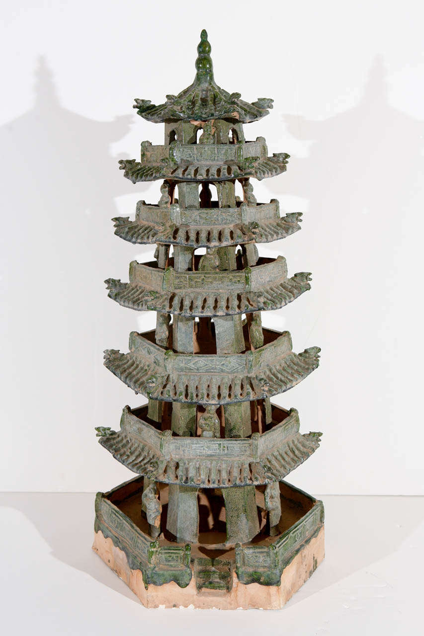 Pair of circa 1920, hand-thrown, glazed, six-tier, terracotta pagodas with figures.